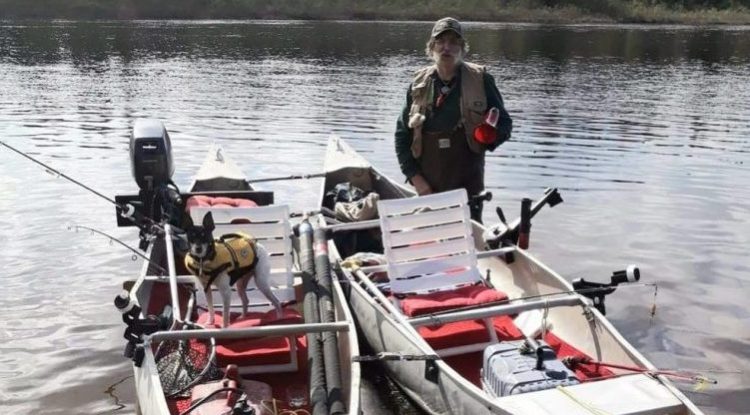Michael Fiori is seen with a pair of tandem canoes in the wilderness of northern Maine on Monday,  just  hours before he and his brother Larry ended up in a fight for their lives when the canoes capsized in 50-degree water. 