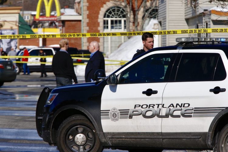 Police officers block off the scene where an officer shot Chance Baker at Union Station Plaza in Portland in February 2017.