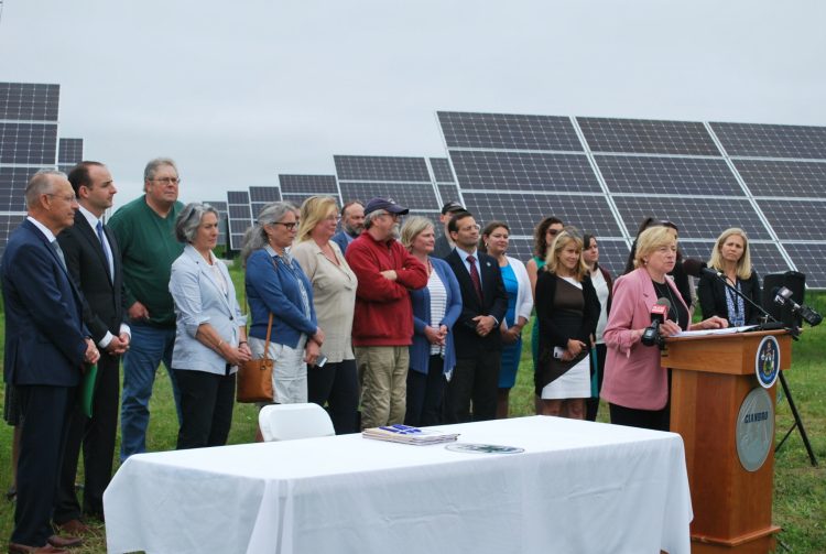 On Wednesday Maine Gov. Janet Mills signed into law new initiatives to expand solar power and clean energy in Maine. The bill-signing ceremony was in front of solar panels at Pittsfield Solar, a subsidiary of Cianbro Corporation.