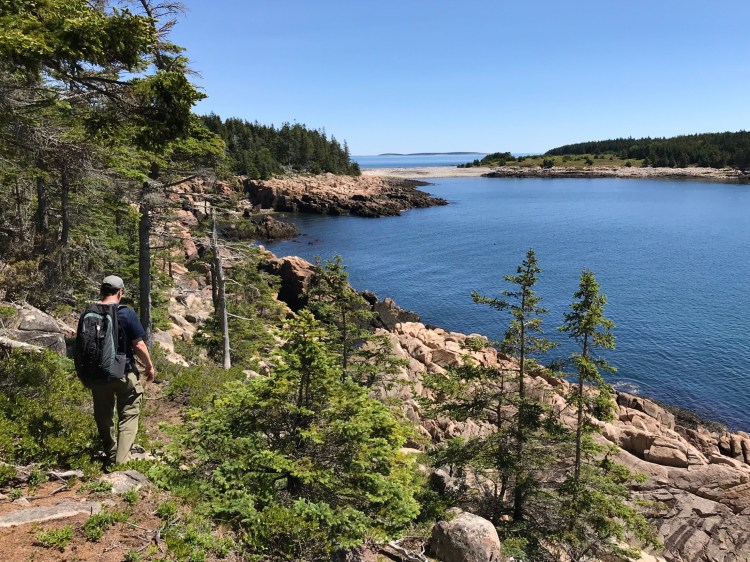 Jeff Romano hikes along Bluff Head headed to West Cove. Nearly 1,200 acres on the island of Frenchboro are preserved, one of the reasons the trails there are extraordinary.