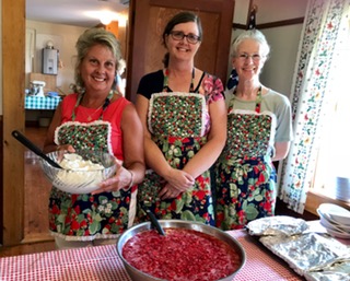 From left, Marilyn Strong-Townsend, Laurie Johnston Bouchard and Lynne Bowers Petrillo prepare for the Bunker Hill Community 51st annual Strawberry Festival
on Sunday, June 30 in Jefferson.