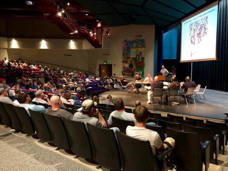 Carl Wilson, director of the marine science bureau of the Maine Department of Marine Resources, tells a group of 150 lobstermen about proposed whale protection rules in Deer Isle Thursday night. This part of the coast is the state’s most lucrative lobster fishery, landing $116.5 million worth in 2018.