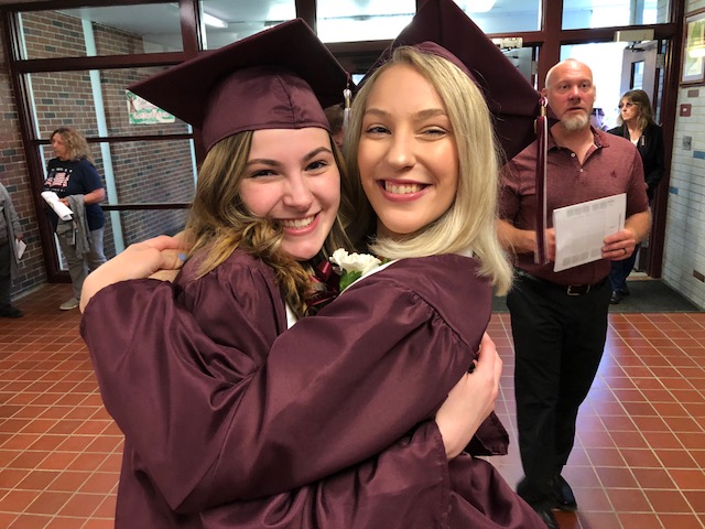 Regional High School Class of 2019 President Alyssa Stankevitz, right, hugs her best friend and fellow senior, Remington Shaw, Friday in the school lobby, before commencement exercises in which Stankevitz gave a speech.