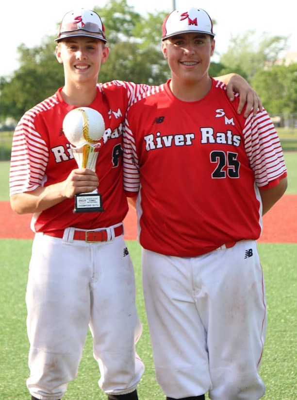Damon (left) and Post pose with the new hardware the River Rats picked up in Quebec this past weekend.