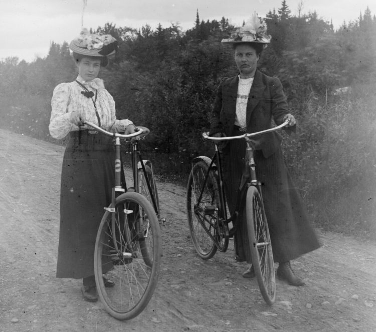 Two women and bikes.