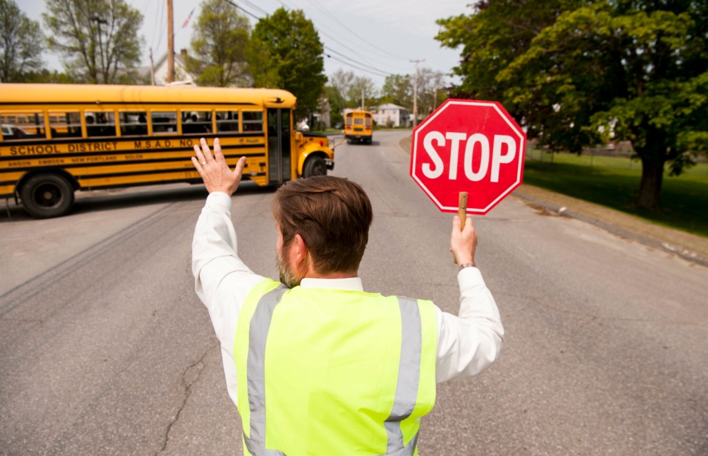 CARRABEC, ME - MAY 31, 2019
Carrabec Community School principal and crossing guard,  Tom Desjardins, waves to his students as they depart the Carrabec Community School on Friday, May 31, 2019. (Morning Sentinel photo by Michael G. Seamans/Staff Photographer)