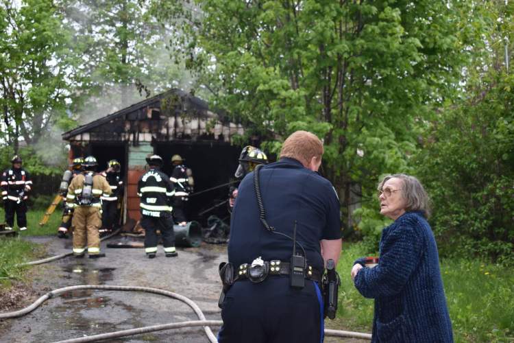 Two teens have been charged with setting a fire that damaged this Rockland garage on May 30.