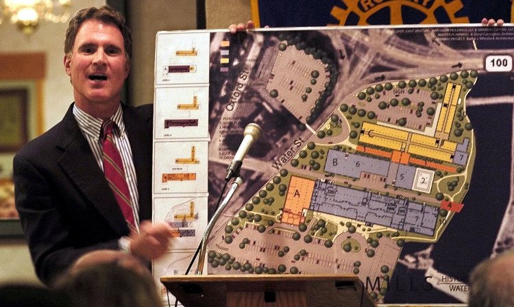 Developer Paul Boghossian holds a drawing of the Lockwood Mills complex in Waterville, including CF Hathaway Co. mill, in a presentation to members of the Waterville Rotary Club in 2008. He has since sold the remaining two Lockwood mill buildings to the North River Company, the current owner of the Hathaway Creative Center.
