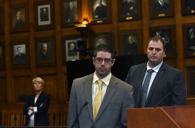 The jury has begun deliberations in the murder trial of John D. Williams, center, who stands accused of killing Cpl. Eugene Cole.
