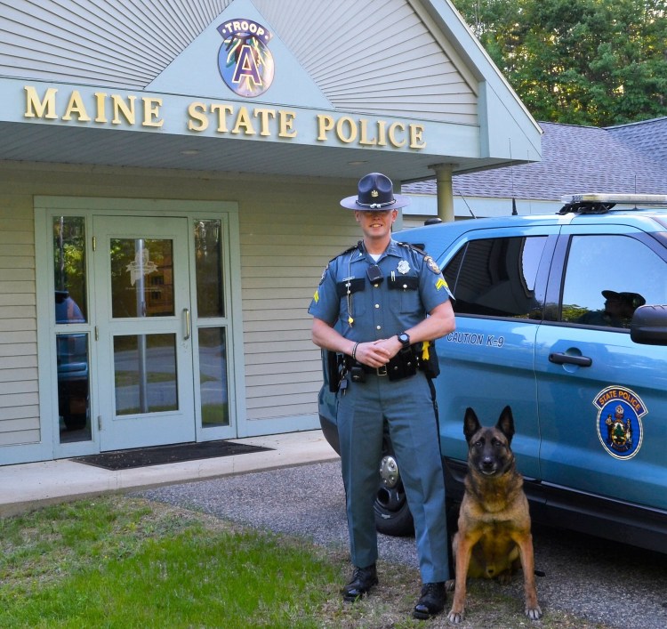 Cpl. Adam Schmidt of Maine State Police Troop A in Alfred, shown with his canine partner, Ibo, was named Trooper of the Year in ceremonies at the Maine Criminal Justice Academy in Vassalboro on Friday.