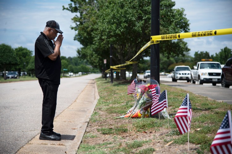 Edmond Maynard pays his respects to the victims of the deadly shooting in Virginia Beach, Va. 