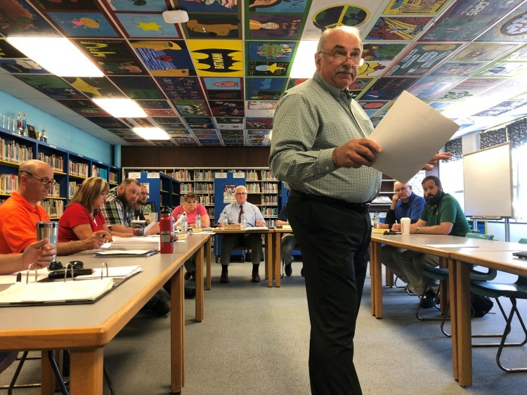 Construction Manager Peter Pelletier, of Ledgewood Construction, pictured here at a June meeting of the Winslow School Board, said then he expected the district could afford to add the cafeteria back in — as well as all of the "add-alternates" — after bids came in low for the rest of the project. 