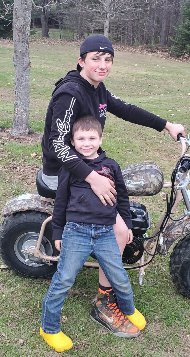 John Hovey IV, 13, of Skowhegan, poses this year with his 5-year-old brother, Jacob Stadig. Hovey died as the result of a dirt bike crash Monday night. 
