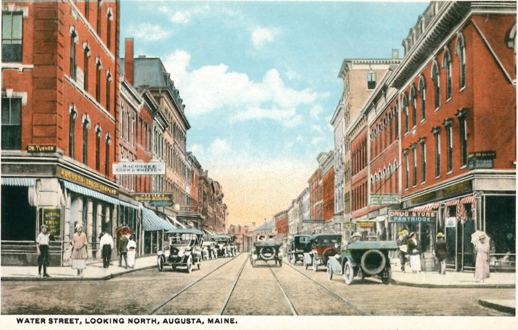 This undated postcard shows two-way traffic on Water Street looking north from Winthrop Street in downtown Augusta.