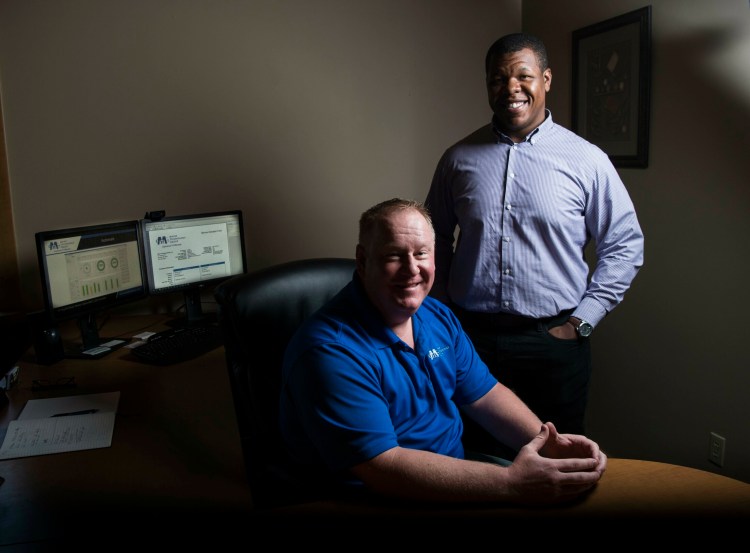 Scott MacDonald, left, CEO and Founder of the Maine Tech Group, is seen with his business development director, Sean Conerly, at their new office Monday in Oakland. 
