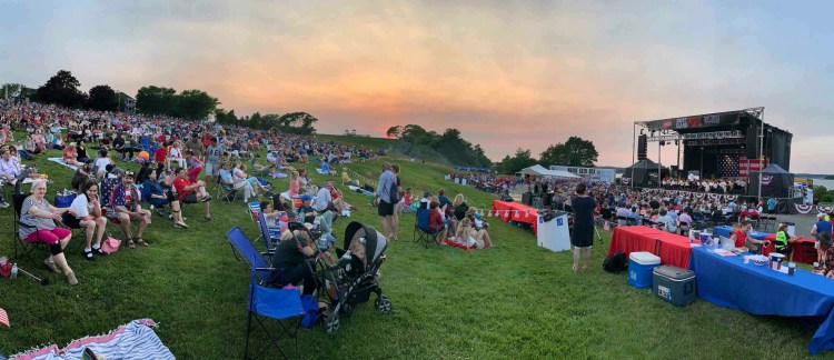 In this panorama photo, people listen to the Portland Symphony Orchestra's performance on the Eastern Prom before the fireworks display on Thursday night.