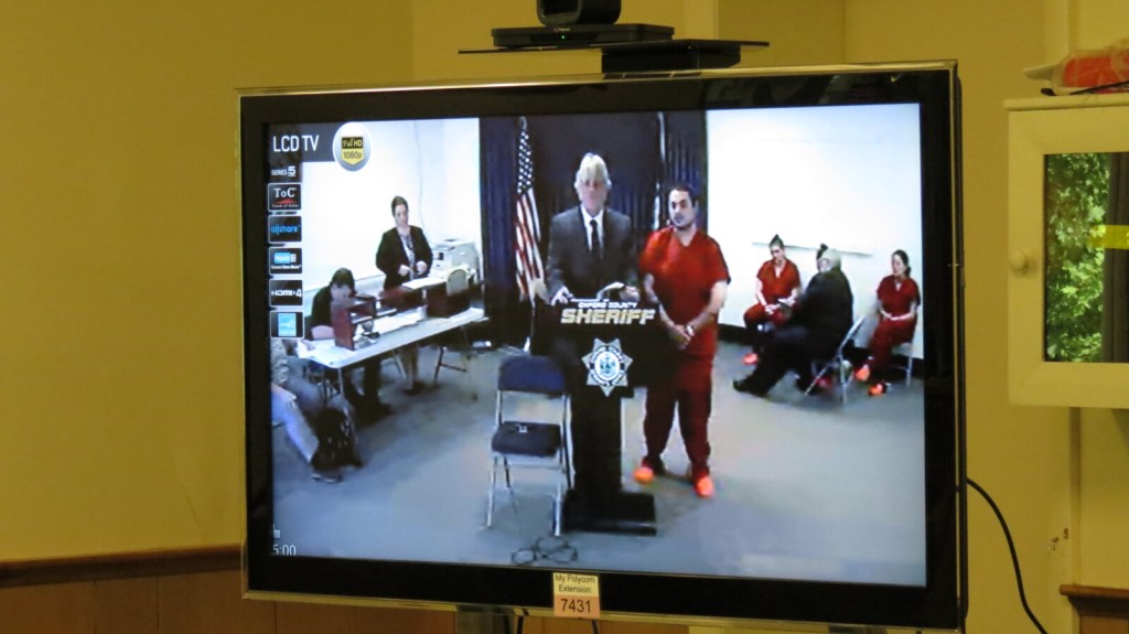Travis Walker appears Wednesday via video conference before Judge Nancy Carlson at Oxford County District Court. Walker was at the Oxford County Jail in Paris. 