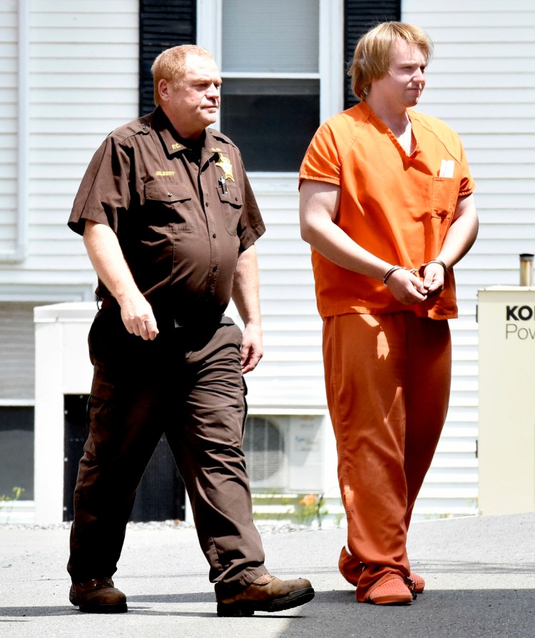 Christopher Hallowell, right, is led by a sheriff's deputy Tuesday into the Piscatquis County Jail in Dover-Foxcroft after a hearing on charges including aggravated attempted murder after his arrest Monday morning in Albion.