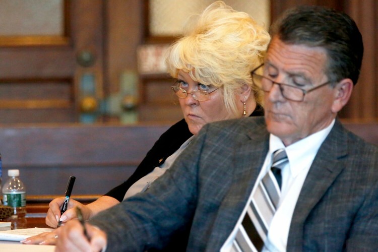 Annemarie Germain listens to opening arguments with her attorney Gene Libby on July 15 at the Cumberland County Courthouse. The Portland Museum of Art sued Germain, saying she manipulated a wealthy benefactor to remove a large donation from her will. 