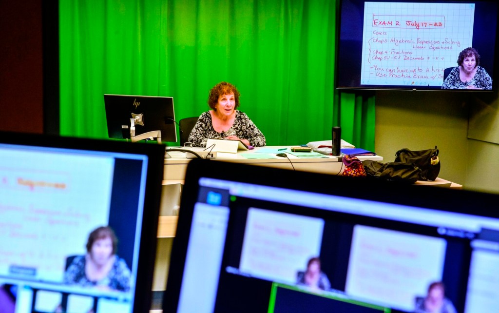 Linda Rottman teaches Foundations of Mathematics on Wednesday at the University of Maine at Augusta. There was one student in the room with her and one student watching the  live streaming, many distance learning class students watch the recorded class later. 