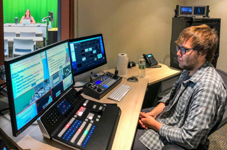 AUGUSTA, ME - JULY 17: Wendy St. Pierre, left, teaches Community Mental Health class as media services technician Luke Martin runs the board in control room on Wednesday July 17, 2019 at the University of Maine at Augusta. (Staff photo by Joe Phelan/Staff Photographer)