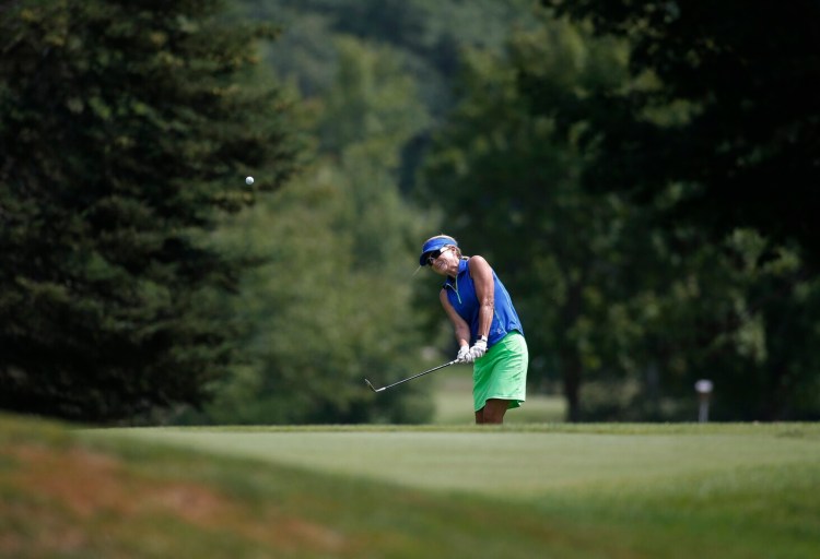 Carrie Langevin of Winthrop hits onto the seventh green during the Maine Women's Amateur on Wednesday in Kennebunk.. Langevin, the first-round leader, shot a 6-over 78 to finish second.