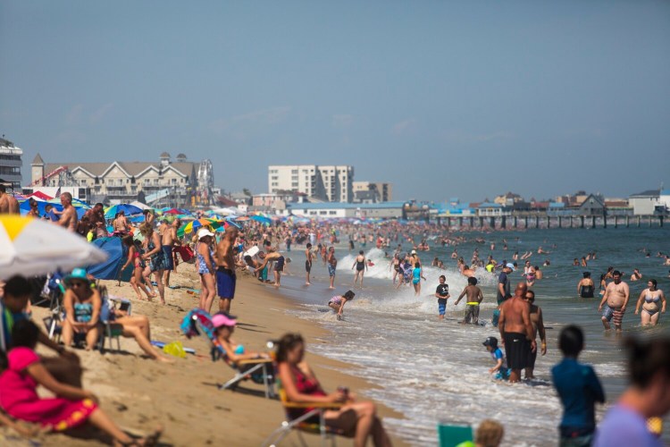 Visitors pack Old Orchard Beach where temperatures reached the 90s on Saturday and Sunday. 