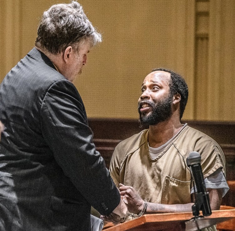 Jamil Dabson of New York City speaks to defense attorney Donald Hornblower after prosecutors dropped a drug charge against him in Androscoggin County Superior Court in Auburn in July.