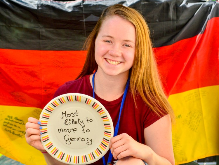 Maggie McQuillen poses for a portrait Wednesday at her home in Manchester. The award was from an end-of-school-year event from the school she attended in Germany.