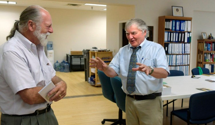 Rob Gordon, right, speaks with Richard Parkhurst on Wednesday at the United Way offices in Augusta. Gordon is retiring from the United Way, which the Parkhurst family has supported for several years.
