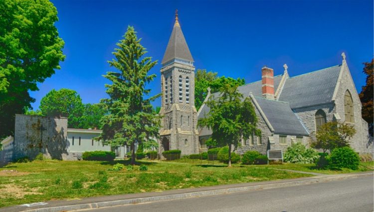 St. Mark's Parish Hall, left, and church in Augusta are seen June 24, 2018. New owner Adam Turner plans to convert much of the property into housing and the stone church into a community space.