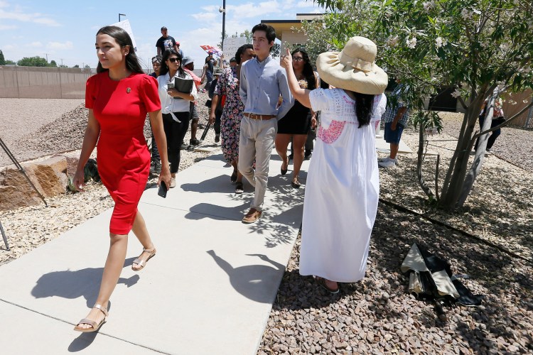 U.S. Rep. Alexandria Ocasio-Cortez, D-New York, walks to the front of the Clint Border Patrol station to talk about what she saw at border facilities Monday.