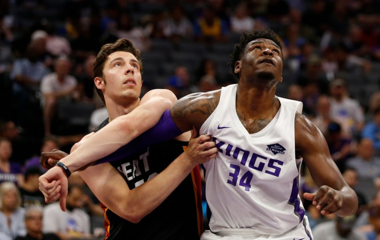 Miami Heat forward Nick Mayo, left, and Sacramento Kings forward Marcus Derrickson wait for a rebound during the first half of an NBA basketball summer league game in Sacramento, Calif., Tuesday, July 2, 2019. (AP Photo/Rich Pedroncelli)