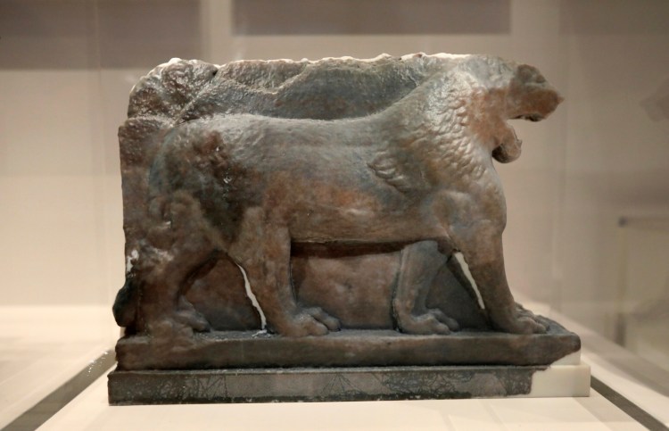 A 3D printed recreation of the ancient Lion of Mosul, which was destroyed by the Islamic State group at the Mosul Museum in Iraq, is displayed as part of the 'What Remains' exhibition at the Imperial War Museum in London, Wednesday, July 3, 2019.  The exhibit, which runs from July 5 until January 5, 2020, explores why cultural heritage is attacked during historical and contemporary conflicts. 