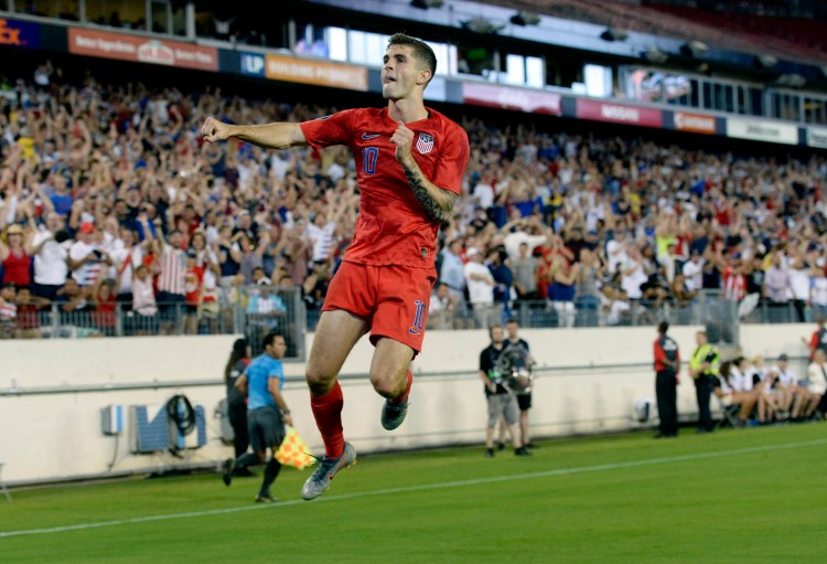 Christian Pulisic of the U.S. celebrates after scoring one of his two second-half goals Wednesday against Jamaica. The U.S. won 3-1 and will meet Mexico in the Gold Cup finals.