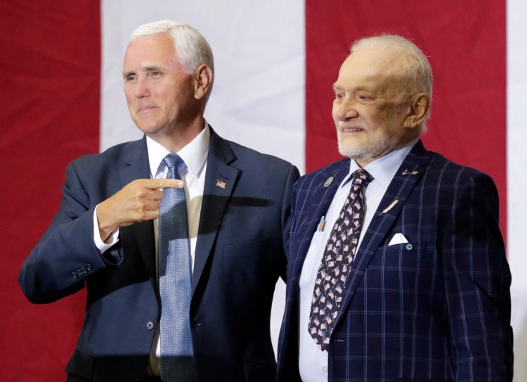 Vice President Mike Pence, left, celebrates with Apollo 11 astronaut Buzz Aldrin during an event at the Kennedy Space Center in recognition of the launch's 50th anniversary, Saturday in Cape Canaveral, Fla.