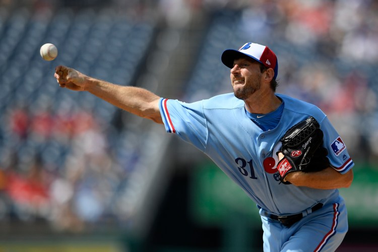 Washington starting pitcher Max Scherzer struck out 11 in seven shutout innings as the Nationals, wearing Montreal Expos throwback uniforms, beat the Kansas City Royals 6-0 on Saturday in Washington.
