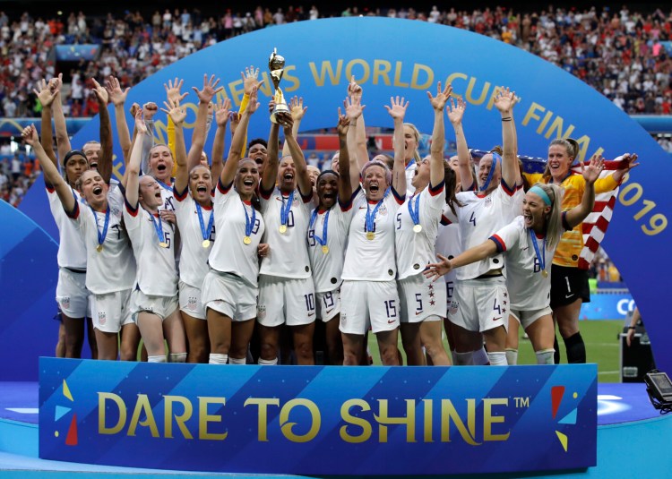 The United States women's soccer team celebrates after beating the Netherlands 2-0 to win the Women's World Cup on Sunday in Lyon, France.