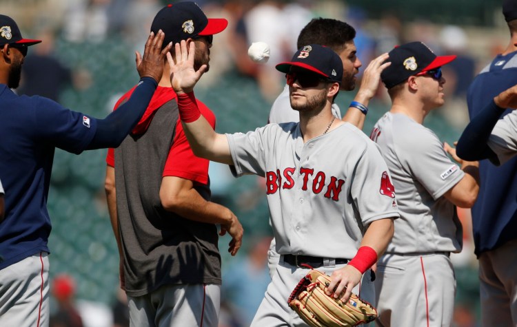 Andrew Benintendi and the Red Sox celebrate after beating the Detroit Tigers for their fifth win in six games on Sunday. Boston gained some momentum heading into the All-Star break, sweeping the Tigers.