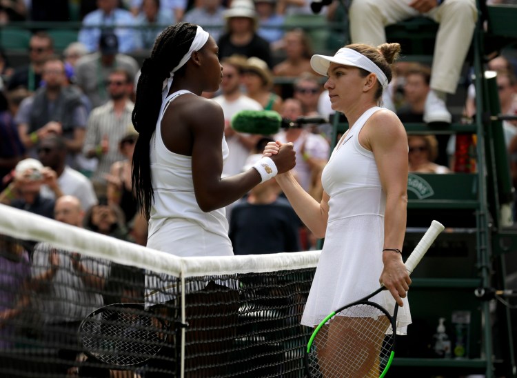 Simona Halep shakes hands with Coco Gauff in their fourth-round match at Wimbledon on Tuesday. Halep ended the 15-year-old's run with a 6-3, 6-3 win.