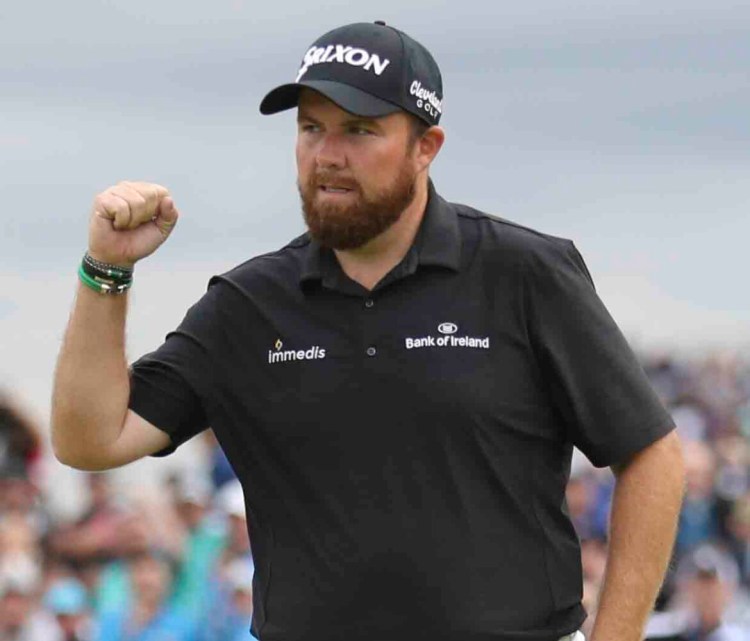 Ireland's Shane Lowry celebrates after making a birdie on the 15th hole during the third round of the British Open Saturday. 