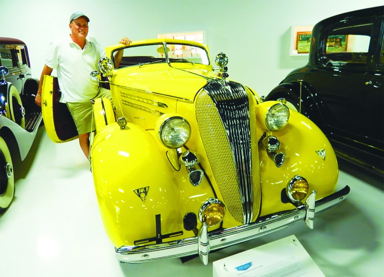 Tim Stentiford of the Maine Classic Car Museum shows off a 1936 Hudson Super 8 at the museum in Arundel. More than 160 rare, vintage and classic cars are in the museum's collection. 
