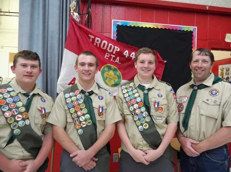 Eagle Scouts from left are Jonathan Roy, Michael Roy and Seth Pellerin, with Scoutmaster Mathew Dow Sr. 