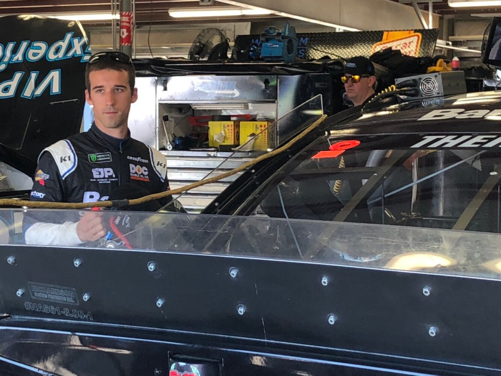 Austin Theriault of Fort Kent looks on at activity in the garage area during Monster Energy NASCAR Cup Series practice Friday at New Hampshire Motor Speedway in Loudon, New Hampshire.