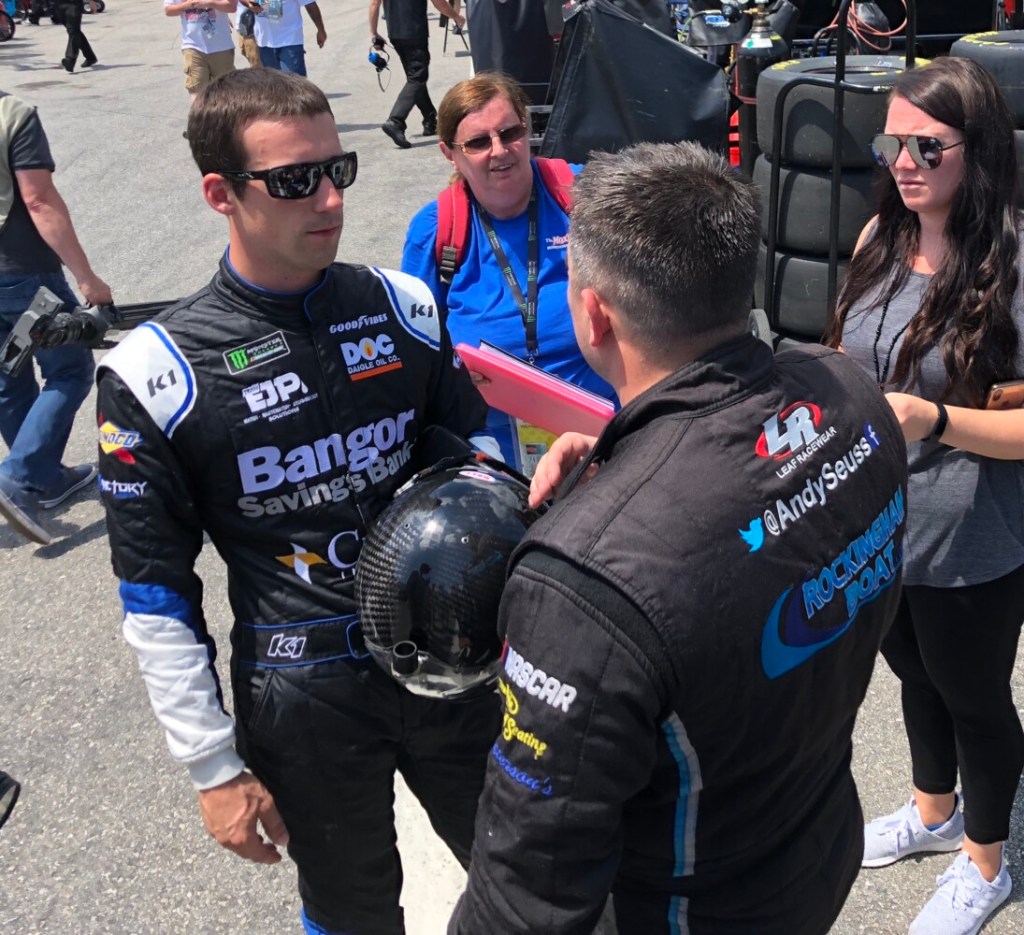 Austin Theriault of Fort Kent, left, talking to teammate Andy Seuss, makes his first career start Sunday at NASCAR’s top level.