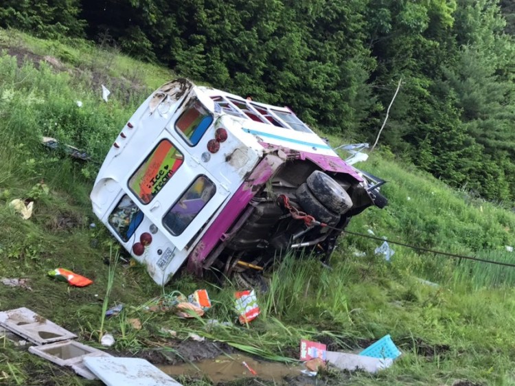 A bus that had been converted into an ice cream truck went off the road following a crash while it was traveling north on Interstate 295 in Bowdoinham on Monday.