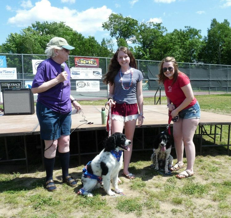 "Mozzie" and "Trace" with Mirren Hibbert, center, and Lily Grover, with Joanne Dunlap, left, president of the Rangeley Lakes Chamber of Commerce.
