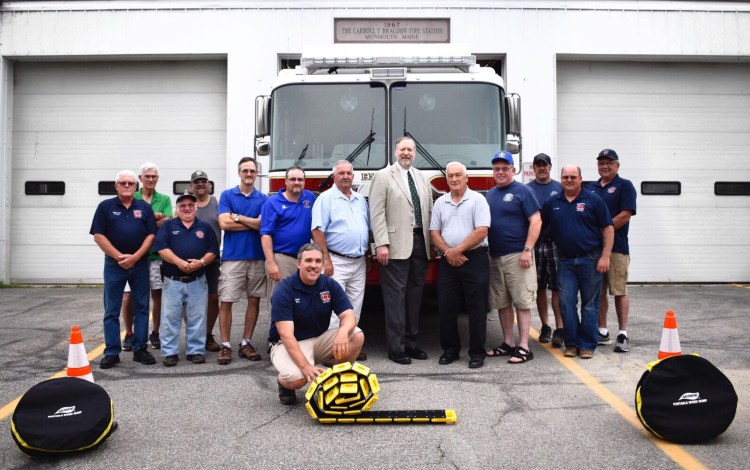 The Masons of Monmouth Lodge 110 recently met with members of the Monmouth Fire Department to present four portable speed bumps to the firefighters. From left are Assistant Chief Ed Pollard, Jimmy Price, Assistant Chief Pat Smith, Ed Garnier, Lt. Ron Cook (Mason), Senior Warden Mike Clinton (Mason), Tony Perkins (Mason), Most Worshipful David Walker (Mason), Worshipful Master David Stevens (Mason), Hugh LeMaster (Mason), Luke Boucher (Mason), Lt. Lance Reny (Mason), Assistant and Chief Ken Palleschi. Fire Chief Dan Roy (Mason) is kneeling in front.