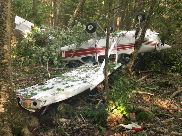 Aircraft wreckage lies in Hidden Valley Camp woods in Montville after a crash July 3 that injured the plane's three occupants.