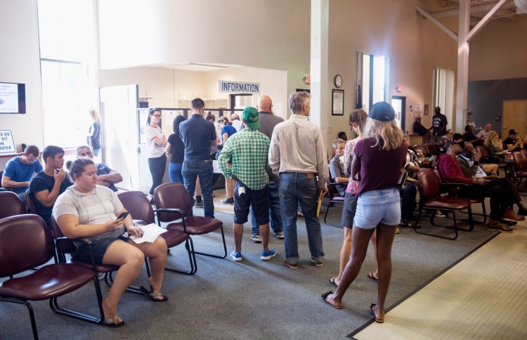 A lobby full of people wait for their numbers to be called at the Bureau of Motor Vehicles on Friday, August 30, 2019. The BMV is experiencing extra long wait times due to a multitude of reasons, including an employee shortage. 